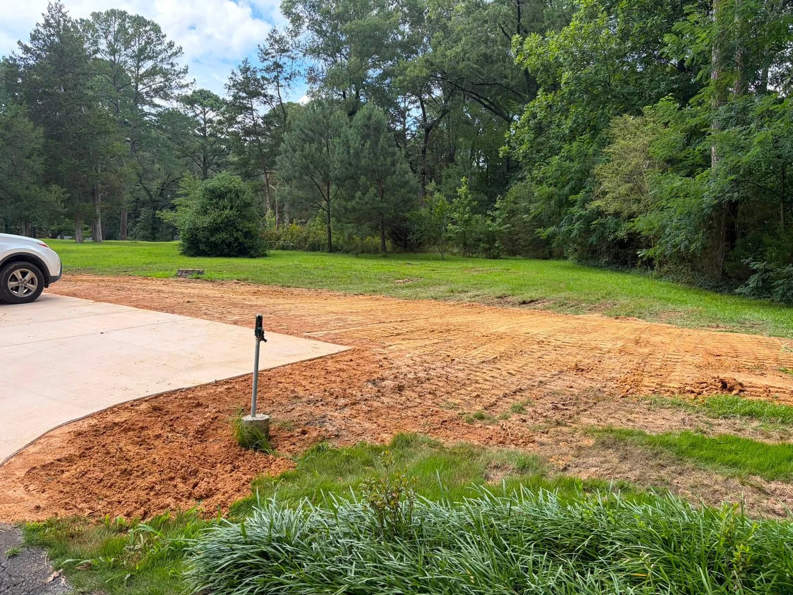 Finished graded ground meeting a fresh lawn edge
