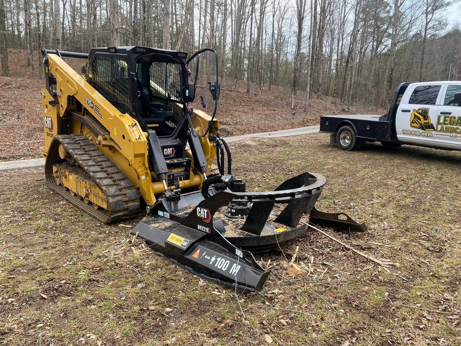 CAT track loader with brush mulcher clearing wooded land in Northwest Georgia